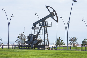 Oil pump pumping oil in former oil fields. Equipment of the oil industry. Baku, Azerbaijan,