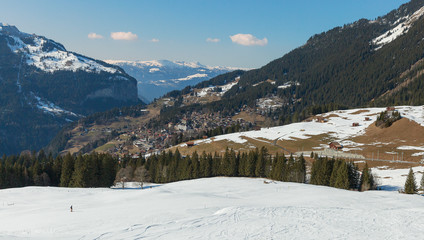 Fototapeta na wymiar snow on hill and village in winter