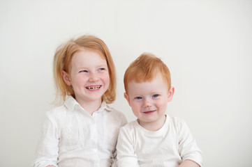 A girl with dental caries and a boy with a scratch on her nose