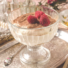 Dessert with raspberry close-up