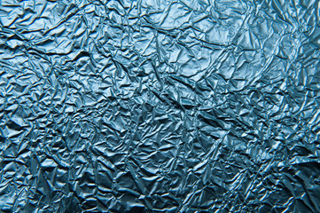 Texture of crumpled blue foil. Metallic background