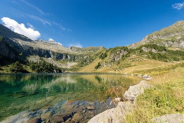 Fototapeta na wymiar Camp Lake (Lago di Campo). With the peak of Re di Castello - Trento Italy 