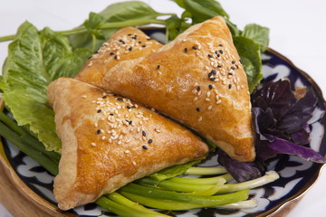 Oriental meat pies with greens
