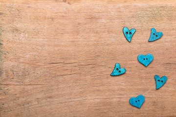Small hearts on wooden background. Copy space. Valentine's day background.