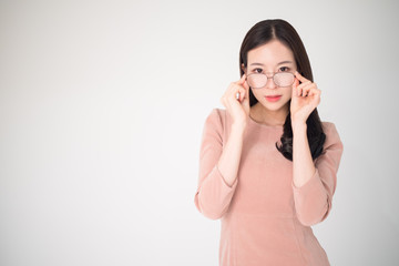 Eye problems concept such as near-sighted, myopia, far-sighted, astigmatism, cataract, glaucoma, ophthalmology, optometry. Asian woman holding eyeglasses fasion isolated on white background