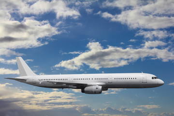 A huge passenger plane in a calm flight against a background of clouds
