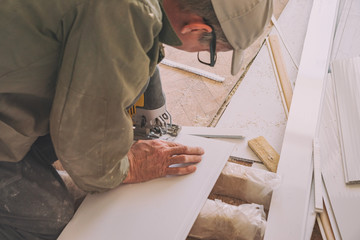 Builder works with white plastic parts