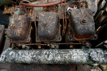 Grain Image: Close up of old machine factory made of steel and used in the past. Broken and rustic machine left over in abandon factory. Image of aged equipment with rust and gear part.