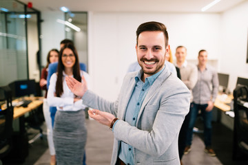 Portrait of business team posing in office