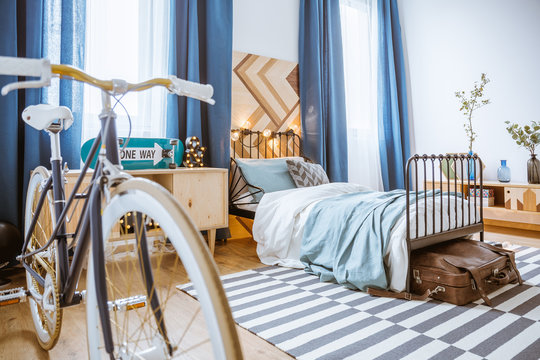 Bicycle in blue bedroom interior