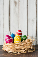 Colorful easter eggs in nest