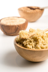 Wooden Bowl full of quinoa.