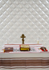 Cross on table with Bible