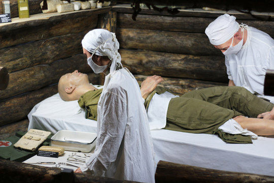 Exhibits of military doctors providing medical care
