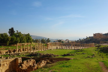 Fototapeta na wymiar The Oval Forum in Jerash, an unusual wide, asymmetrical plaza at the beginning of the Cardo built in the 1st century AD, Jordan, Middle East
