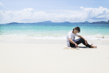 Women sitting by the sea