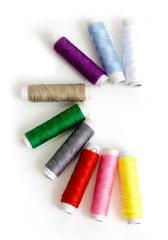 Small multicolor sewing threads row align half circle shape for quick repair clothes