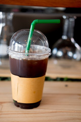 Plastic cup of iced black coffee