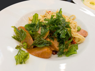 spaghetti spicy sausage.Thai style food in white plate