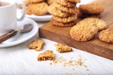 Tasty cookies on wooden board.