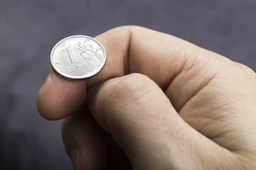 Close up of tossing one Russian ruble coin