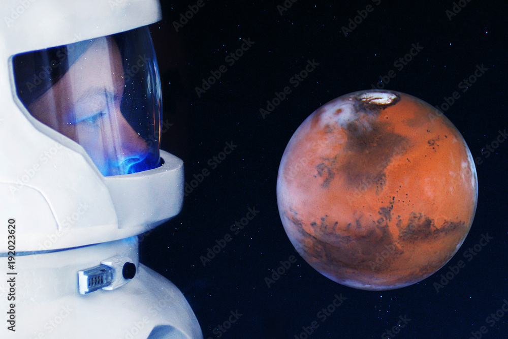 Wall mural development of mars, concept. astronaut, looking at the planet mars. elements of this image furnishe