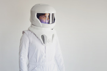 Astronaut in a helmet looking to the right. Fantastic space suit. © Ulia Koltyrina