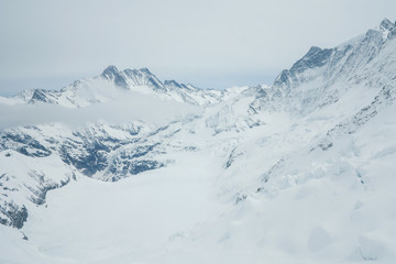Fototapeta na wymiar View on the peak of the biggest glacier of jungfrau. Bernese Oberland, Switzerland. Swiss Alps