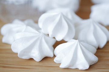 Fototapeta na wymiar White fresh tasty meringues on wooden table 