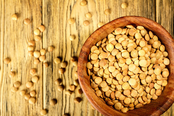 Lentils on the plate. Healthy diet. The family of legumes. Rustic style. Place for text.