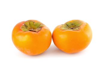 fresh ripe persimmons isolated on white background