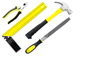 Tools for repair and building. Hummer, file, corner ruler, pilers on white background top view copy space