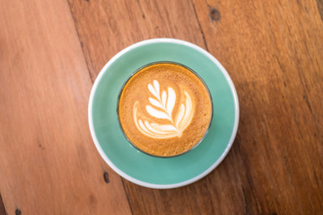 top view latte art on wooden table background