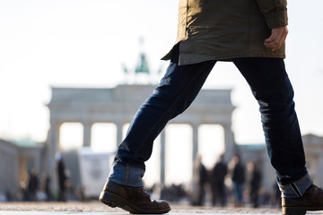 a man at brandenburg gate berlin germany © Tobias Arhelger