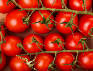 Small red cherry tomatoes on a box