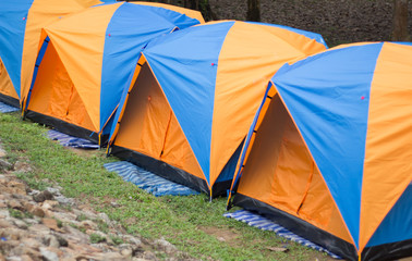 Camping and many tent in tropical forest.