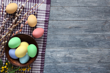 Colorful easter eggs on wood background