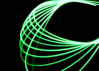 Spirographic, abstract, light patterns on a black background created with L.E.D. lighting that looks like lasers lights