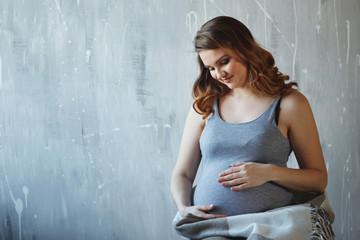 Fototapeta na wymiar Happy pregnant woman in studio.