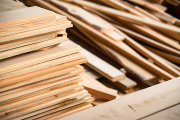 Many wooden beams stored at carpenter's