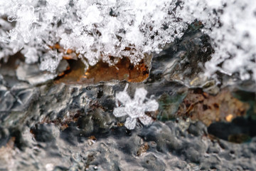 Macro photography of snowflake taken in paris during snowfall in Paris. A snowflake is a single ice crystal. looks like ice but very small and very light. it has many shape and used as snow symbols