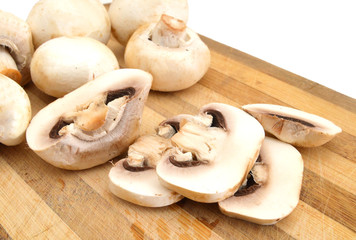 Champignon on wooden background