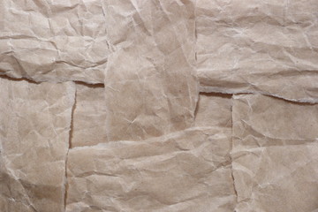 brown ripped crumpled kraft paper scraps garbage beige texture background for design background vintage old paper close-up