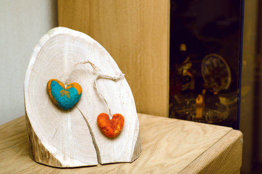 Two hearts on a wooden block of wood