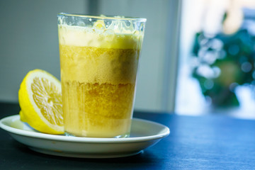 A glass of traditional drink for stamina or energy drink with eggs and tea. Teh talua or teh telor is a tea beverage from West Sumatra. The tea is unique because of the use of egg yolk.