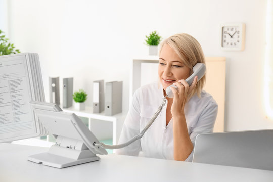 Female receptionist working in hospital