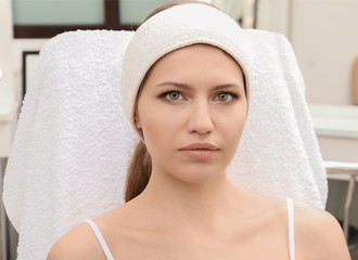 Young woman with natural eyebrows in salon