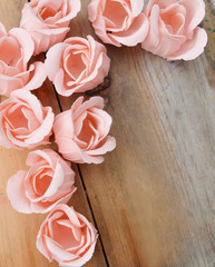 Romantic floral frame background/ Valentines day background/Pink roses on wooden background