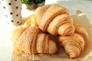 Delicious croissants on table, closeup