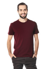 Fototapeta premium Young man in stylish t-shirt on white background. Mockup for design